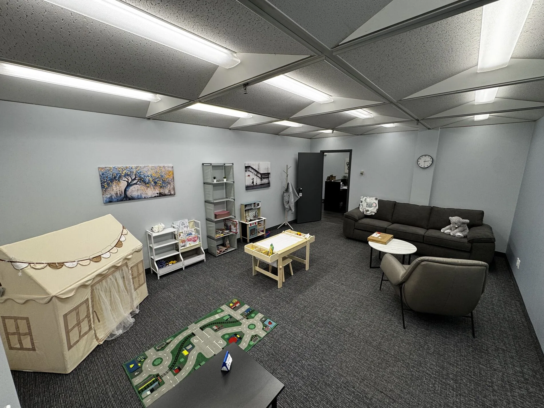 A soft, calming therapy room at Flutterby Psychology