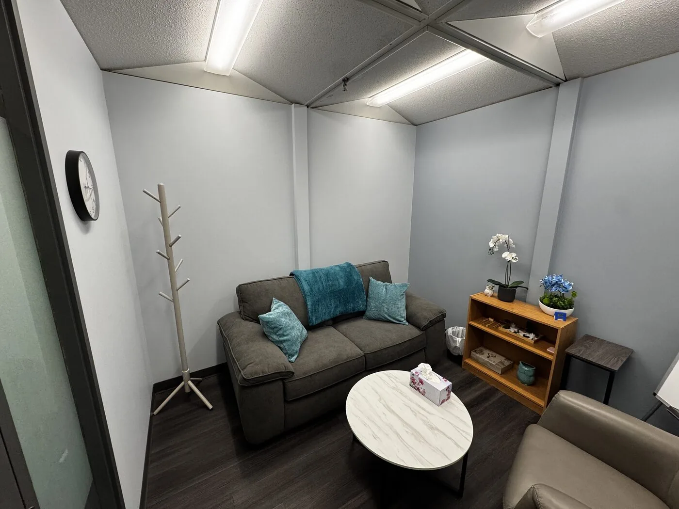 A warm counselling room at the Flutterby Psychology Calgary office