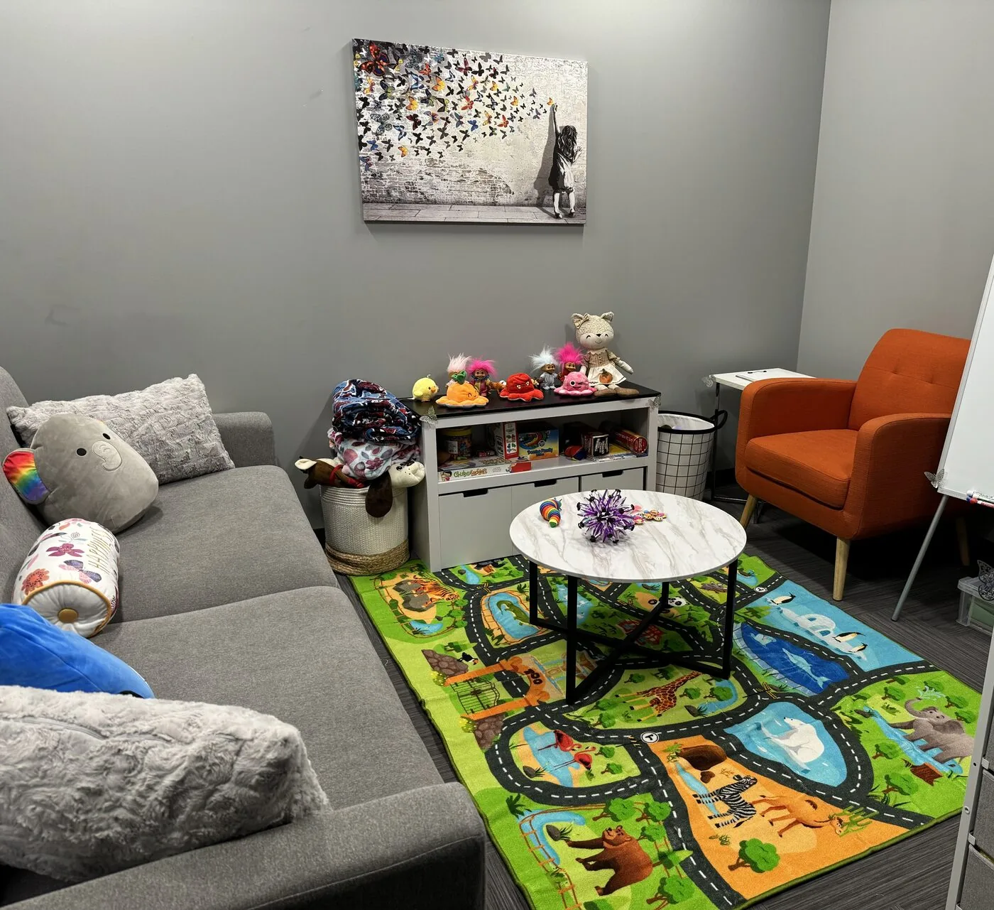 The cozy, child-friendly play and counselling room at the Flutterby Psychology Okotoks office